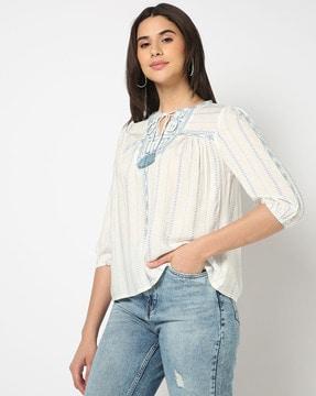 women printed relaxed fit top with neck tie-up