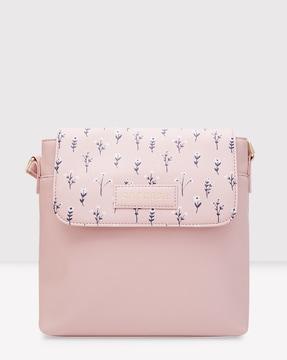 women printed sling bag with snap-button closure