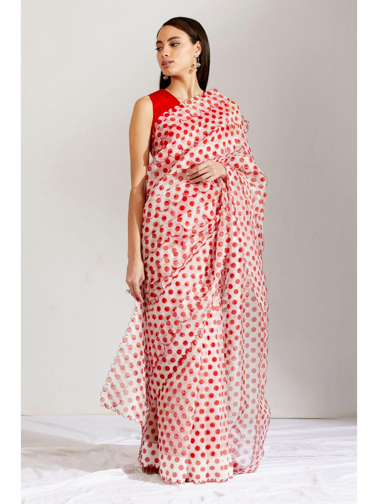 women red polka dots saree with stitched blouse