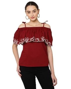 women regular fit top with embroidered hem