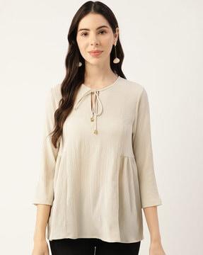 women regular fit top with tie-up