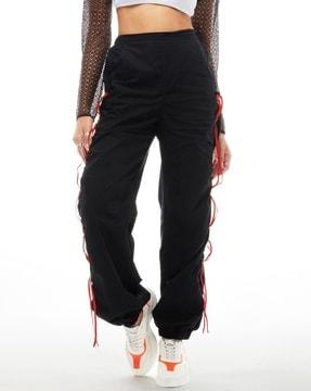 women relaxed fit parachute pants with taping