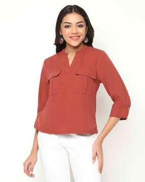 women relaxed fit top with flap-pockets