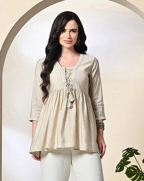 women relaxed fit top with neck tie