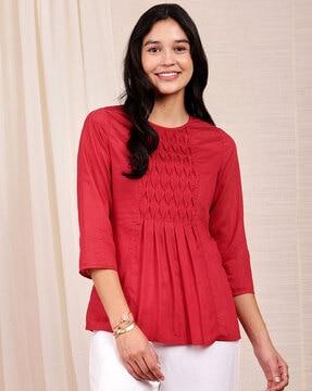 women relaxed fit top with pintuck detail