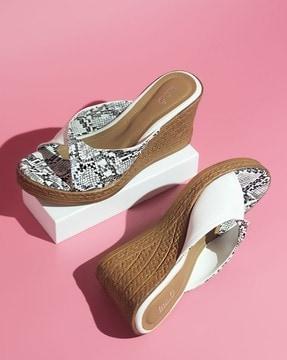 women reptilian print slip-on wedges