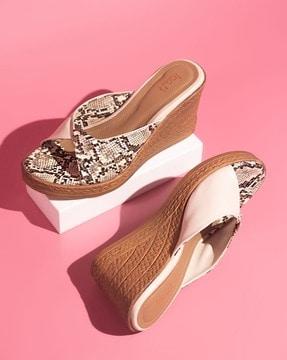 women reptilian print slip-on wedges