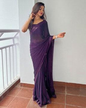 women saree with embellished border