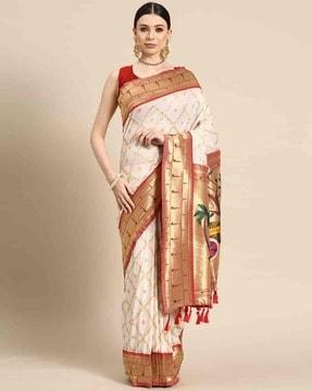 women saree with woven motifs & tassels