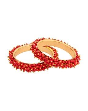women set of 2 gold-plated beaded bangles