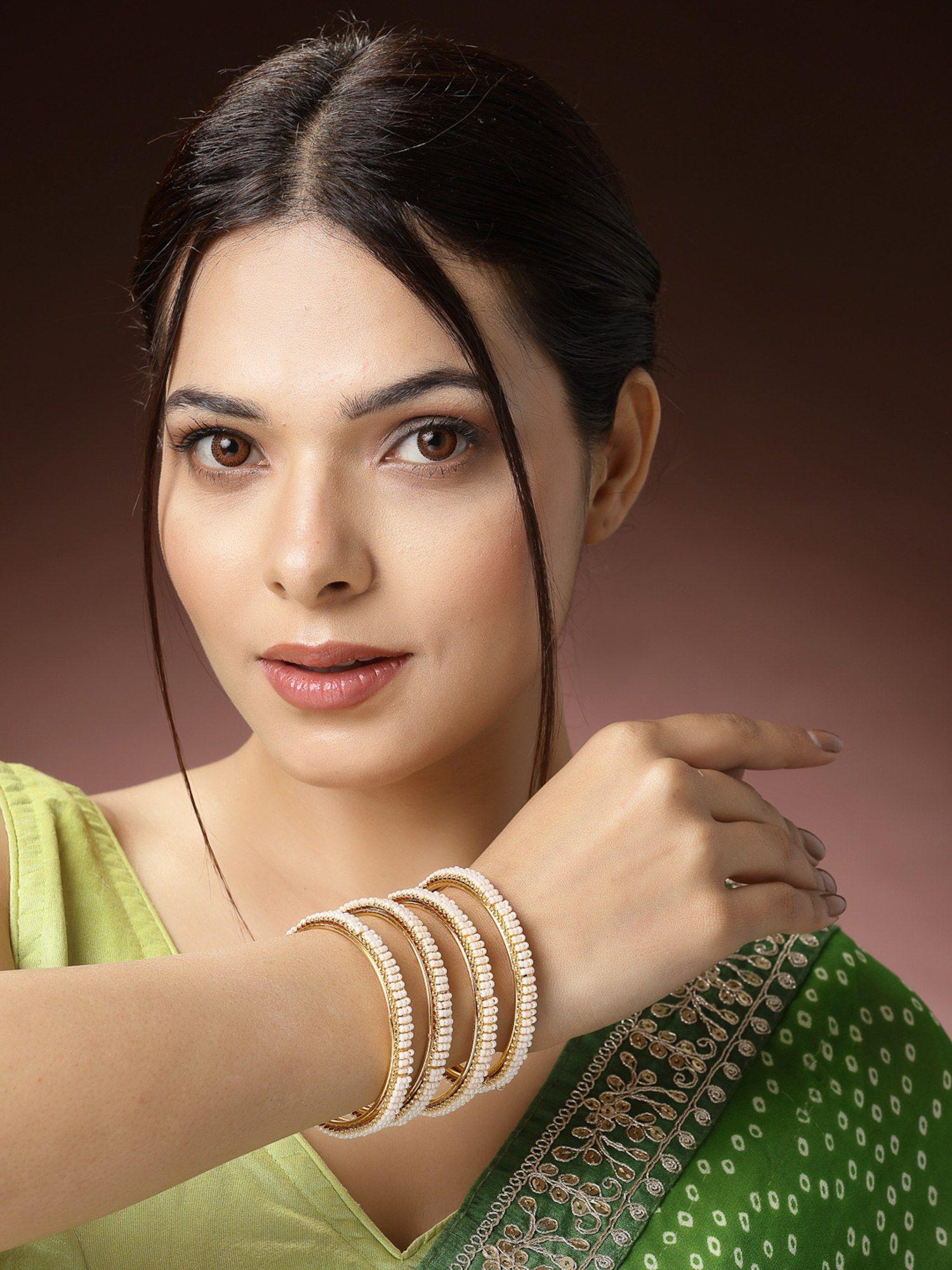 women set of 4 gold-plated pearl handcrafted traditional bangles