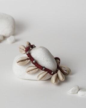 women silver-plated anklets with cowrie shell