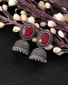 women silver-plated stone-studded jhumka earrings
