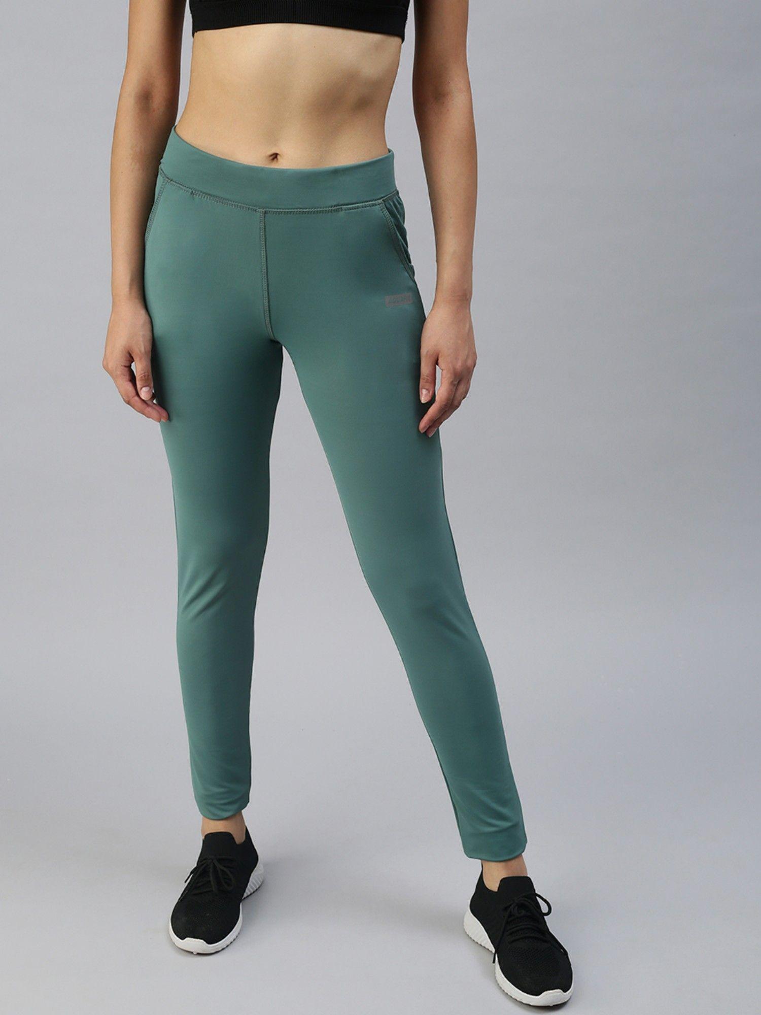 women slim fit green solid track pants