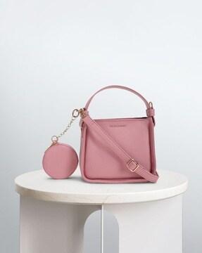 women sling bag with coin pouch
