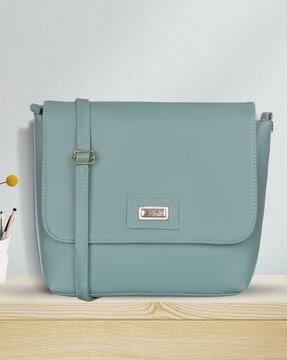 women sling bag with flap closure