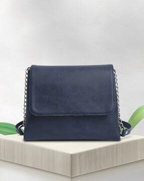 women sling bag with flap closure
