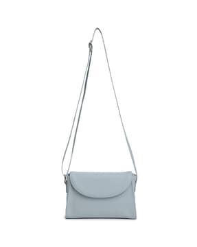 women sling bag with flap closure