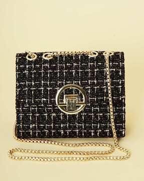 women slingbag with metal accent