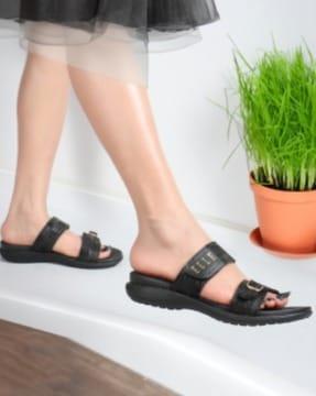 women slip-on flat sandals with buckle fastening