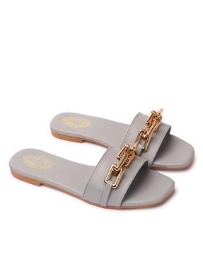 women slip-on flat sandals with metal accent