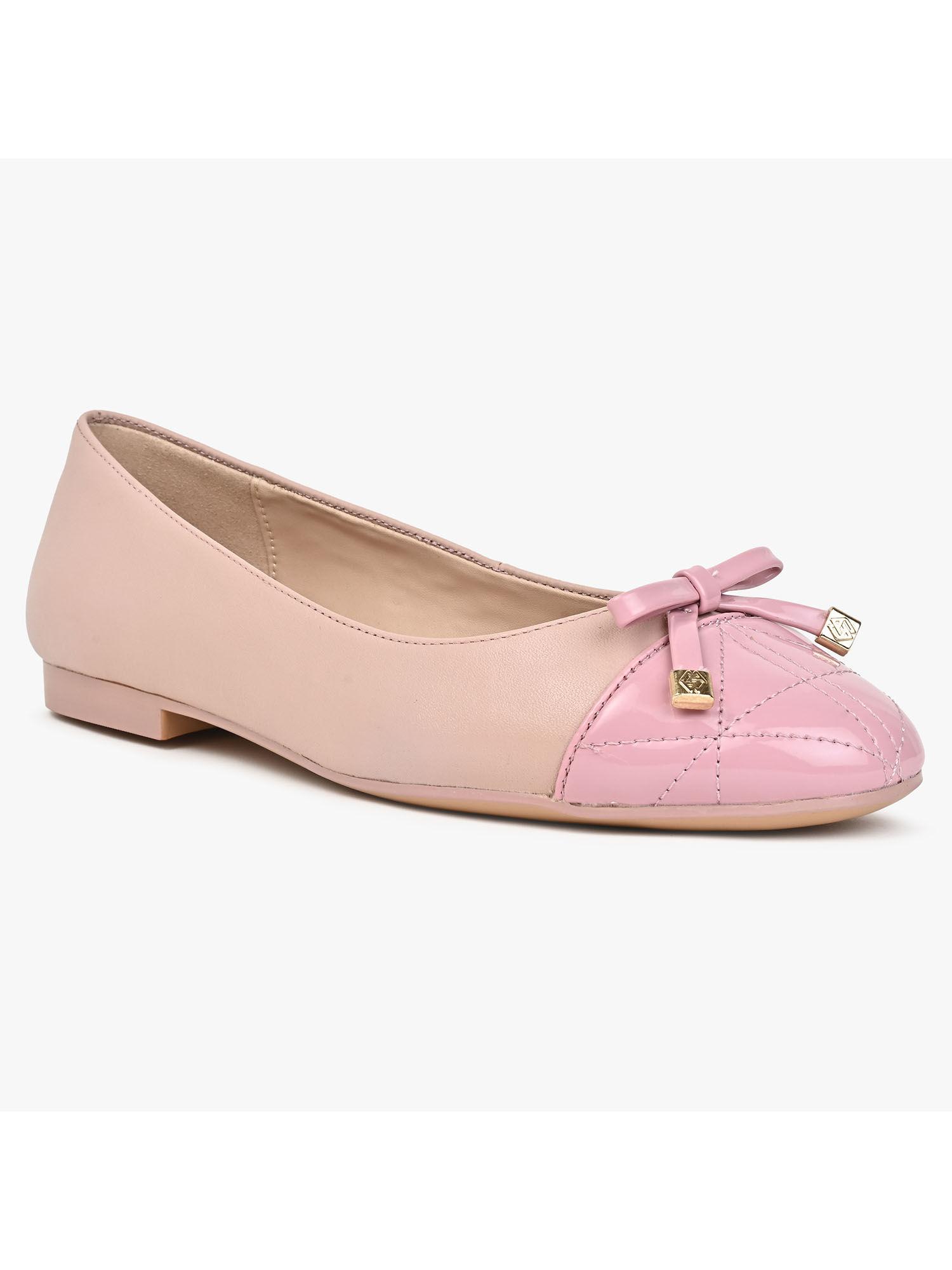 women slip on pink ballerinas