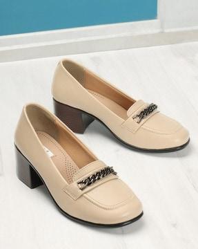 women slip-on pumps with metal accent