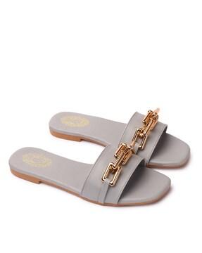 women slip-on sandals with metal accent