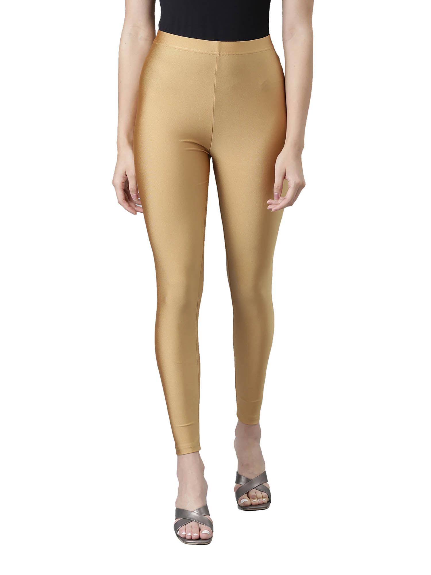 women solid bright gold slim fit shimmer leggings