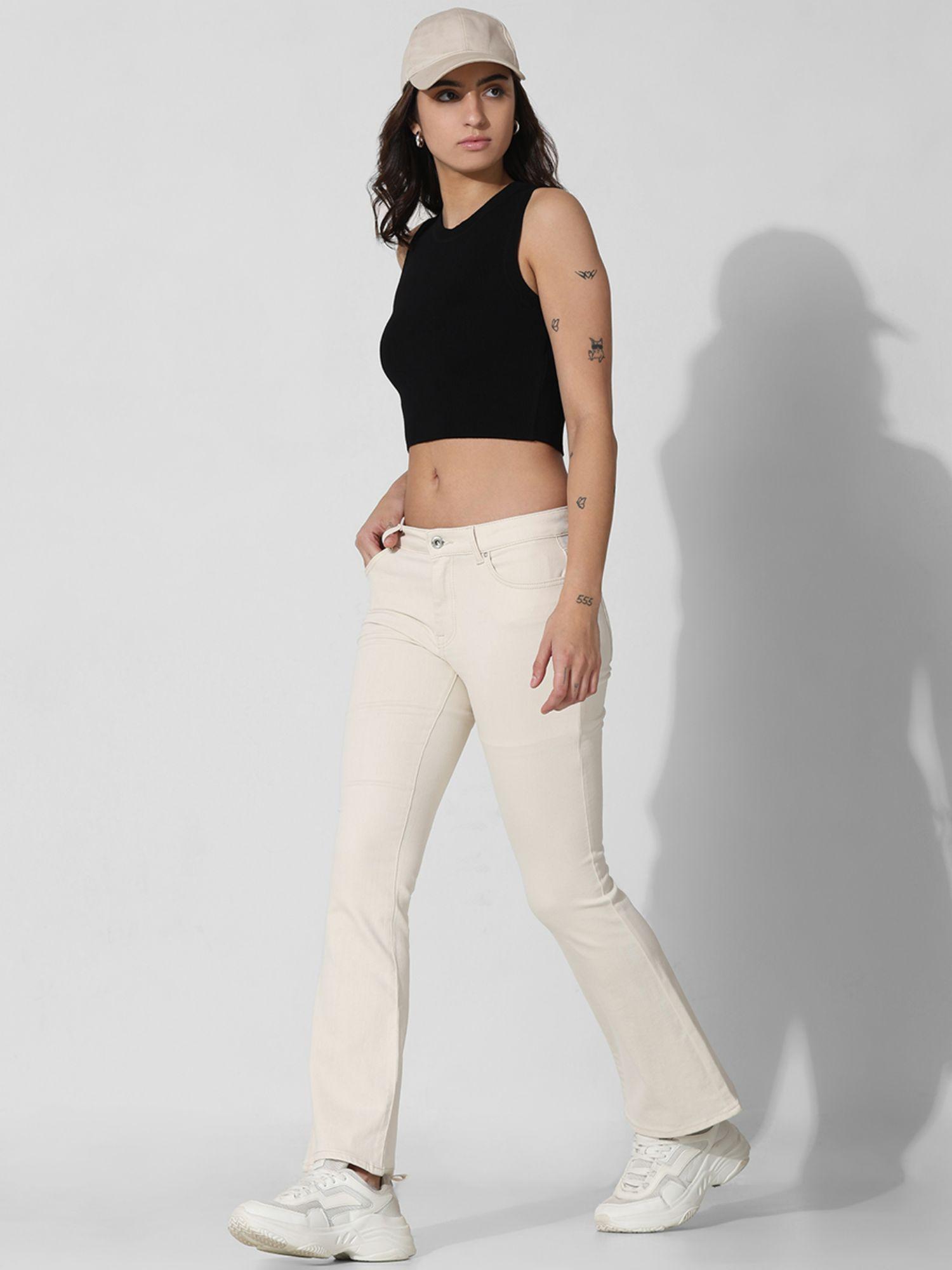 women solid cotton flared fit mid rise cream jeans