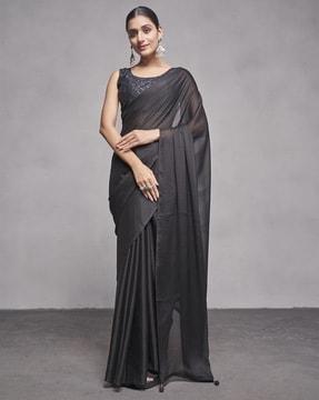 women solid saree with tassels