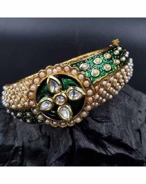 women stone-studded bangle