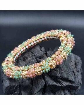 women stone-studded bangle