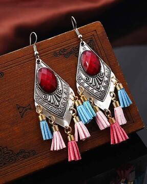 women stone-studded dangler earrings