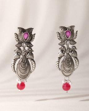 women stone-studded drop earrings