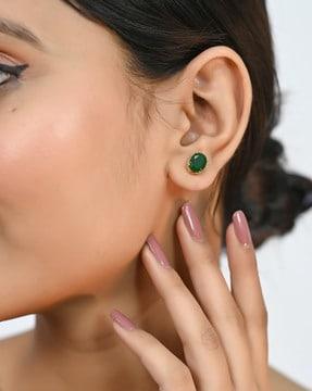 women stone-studded ear studs