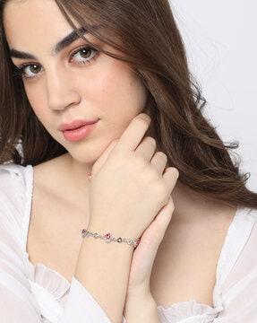 women stone-studded heart charm bracelet