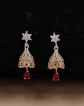 women stone-studded jhumka earrings