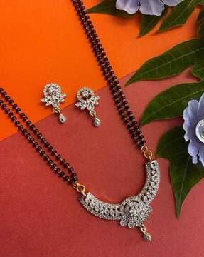 women stone-studded mangalsutra & earrings set