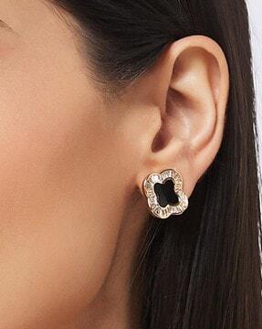 women stone-studded stud earrings