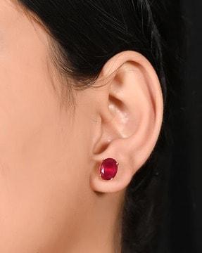 women stone-studded stud earrings