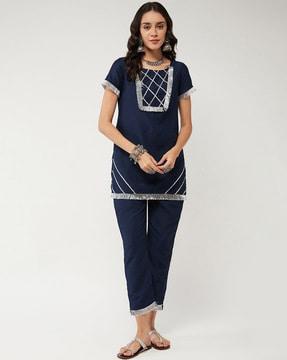 women straight kurta set with fringed hem