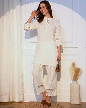 women straight kurta with palazzos