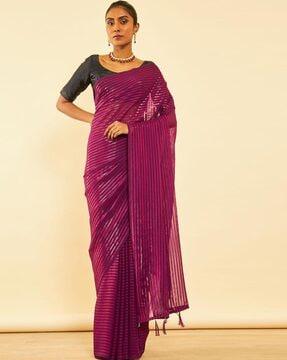 women striped chiffon saree with tassels