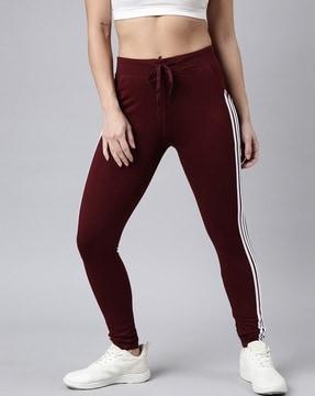 women striped fitted track pants with drawstring waist