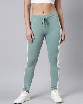 women striped fitted track pants with drawstring waist