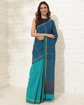 women striped half-and-half saree with tassels