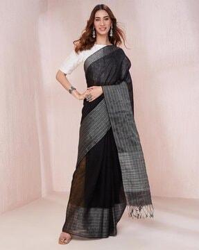 women striped linen saree with tassels