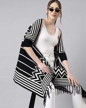 women striped poncho with tassels