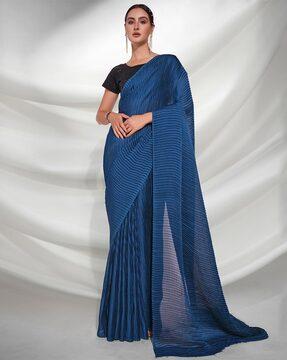 women striped saree with contrast pallu